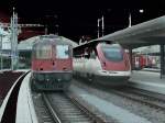 Bhf.Chur/Schweiz.Rechts ein ICN nach Basel,links Re 4/4 11125 mit einem Zug nach Schaffhausen.16.12.09 (Das Bild wurde als  überlichtet abgelehnt,also habe ich es  verfremdet )