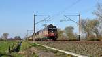 BRLL 185 594, vermietet an HSL Logistik, mit Schiebewandwagenzug in Richtung  Osnabrück (Hüde, 22.03.19).