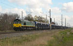 266 064 der BRLL führte am 11.04.19 einen Schotterzug der HHPI durch Braschwitz Richtung Halle(S).