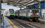 Alt und neu in Parma: Etwas im Hintergrund wartet der Trenord ATR 803 006 (UIC 95 83 4803 006-4 I-TN) wartet als Regionalzug 10804 auf die Abfahrt nach Piadena während rechts im Bild der Trenord