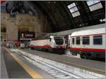 Das schöne an Kopfbahnhöfen: an jedem Ende des Zuges ist (meist) eine Lok zu sehen und zu fotogarfieren - FS E 402 122 in Frecciabianca Farbgebung in Milano Centerale.