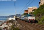 The E444.033 of Trenitalia hauls a special train with damaged coaches here in Cavi di Lavagna.