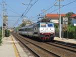 17.7.2014 11:30 E.444 103 mit einem InterCity (IC) aus Bologna Centrale nach Taranto bei der Durchfahrt durch Rimini Miramare in Richtung Riccione.