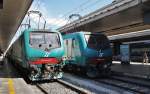 Hier links E464 161 mit R7361 von Toma Termini nach Albano Laziale und rechts E646 212 mit R7358 von Albano Laziale nach Roma Termini, diese beiden Züge standen am 16.7.2011 in Roma Termini.