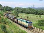 E.655 403 banks a steel train  past Rigoroso, 10 July 2012
