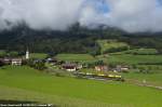 An ETR155 passes in Valdaora with the SAD 23813 from Fortezza to San Candido.