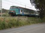 Ein italienischer Regionalzug-Steuerwagen als R2342 Roma - Pisa, in Follonica (Toskana).