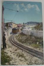 Zeitdokument:AK von 1910,Tram Opicina(1902)in Triest,damals noch zur k.+k.Monarchie gehrend, auf dem Steilstreckenstck.Hier sieht man noch die Zahnstange(Strub)1927/28 wurde die Strecke dann auf