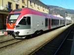 170 155-5 im Design des Landes Trentino als REX 1884 nach Fortezza/Franzensfeste im Bahnhof Lienz.