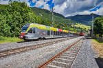 ETR 170 126-6 hält als REX 1858 (Lienz - Fortezza/Franzensfeste) im Bahnhof Abfaltersbach.