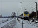 Der IR 115 Liers-Luxembourg mit der leicht verschneiten 3015 fhrt am 05.12.2010 in der Nhe von Lintgen an mir vorbei.