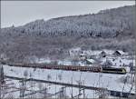 Die 3016 zieht den IR 114 Luxembourg-Liers am 18.12.2010 durch das verschneite Clervaux am verlassenen Campingplatz vorbei.