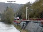 RB 3216 hat den Bahnhof von Kautenbach verlassen und fhrt entlang der Wiltz in Richtung Merkholtz.