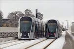 Whrend das Monument im Hintergrund an den Grndungsvater der EU Robert Schuman erinnert, treffen sich am 31.01.2019 zwei CAF Urbos von LUXTRAM S.A.