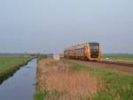 DM'90 ( Buffel ) in Abendlicht zwischen Groningen und Leeuwarden bei Tytsjerk am 7-5-2006.