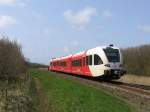 Arriva D-GTW 2/8 10323 mit Regionalzug 37644 Roodeschool-Groningen bei Uithuizen am 16-4-2010.