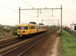DE-II 177 mit Regionalzug 6143 Tiel-Arnhem Velperpoort bei Elst am 15-5-1996.