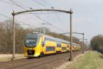 VIRM 8647 mit IC IC 1952 Venlo-Den Haag CS bei Vlierden am 30-3-2013.