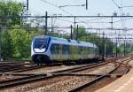 Ein Doppel ET 2400 mit Regional Den Haag CS - Gouda Goverwelle bei einfahrt von Gouda am 03.06 2010.