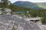 Die norwegische Raumabahn abseits des von Talenten dominierten Planverkehrs - Der einzige planmige Gterzug des Tages von Andalsnes kommmend konnte an der Talengstelle des Raumatals nchst Bjorli