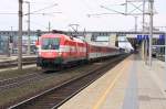 1116 005 mit EC101 bei der Ausfahrt aus dem Bahnhof Wels am 21. 03. 2009.