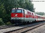 2143 030-1 mit einem Eilzug knapp nach dem Bahnhof Gramat Neusiedel am 11-07-2002