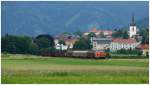 Die  Nostalgielok  2143.035 rollt mit dem Leerzug 63525 (Pöls - Zeltweg), durch das Aichfeld. 
Fohnsdorf 17.6.2014