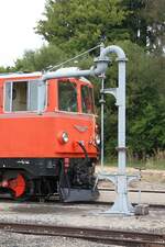 Wasserkran im Bahnhof Alt Nagelberg mit der NOVOG V12 (ex ÖBB 2095.12) im Hintergrund.