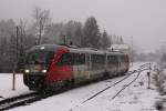 5022 001 verlässt am 09.02.2014 bei sehr dichtem Schneefall als REX/R2711 (Wr.Neustadt Hbf - Fehring) den Bahnhof Ausschlag-Zöbern.