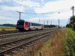 5047 064-0 rattert bei Redl-Zipf unter Fahrdraht Richtung Salzburg; 120718