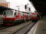 1014 011  Railcargo Austria  fhrt bei starkem Regen in Wien Sdbahnhof/Ostseite mit Ziel Bratislava aus (14.3.2008)