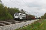 1016 034 mit einem gemischten Gterzug am 01.05.2010 in Haar.