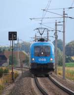 Teleschuss auf den R3972 gezogen von  der 1016 023 am 04.07.2009  bei Wartberg/Kr.