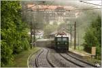 1041.15 fhrt mit Sdz R14551 von Wien FJbf nach Mrzzuschlag.Im Hintergrund sieht man das ehem. Kurhaus Semmering. 
Haltestelle Wolfsbergkogel 28.5.2011