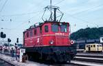 Scan vom Dia: Als Lokzug wartet am 29.07.1986 die 1045.014 in Attnang - Puchheim auf die Abfahrt.