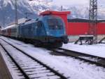 Die 1116 080 Uefa-Euro Lok steht am 13.12.2008 in Innsbruck Hbf mit einem abgestellten City-Shuttel Zug, den sie später als REX 1515 nach Schwarzach St.Veit bringen wird.