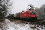 1116 129 mit einem gemischten Güterzug am 13.12.2008 in Haar (bei München).