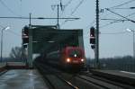 1116 037 mit einem gemischten Güterzug am 05.01.2010 in Wien Praterkai.