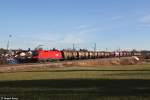 1116 052 mit einem gemischten Güterzug am 23.12.2013 bei Ostermünchen.