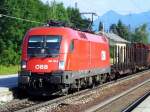 Am 02.07.06 kam die 1116 115-5 vor einem gemischtem Gterzug durch Prien und fuhr Richtung Mnchen weiter.