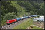 1116 278 mit Güterzug bei Kaisersberg am 30.06.2020.