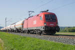 1116 148-8 von der ÖBB ist am 30.04.2024 mit einem Gaskesselzug bei Himmelstadt unterwegs.