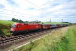 1116 082 auf dem Weg mit einer CS Garnitur nach Linz Hbf kurz vor dem Halt in Pndorf (12.8.2008)