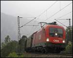 Bei Nieselregen ist 1116 279 mit einem Gterzug von Hall i.Tirol - Salzburg/Wien bei Kiefersfelden unterwegs.