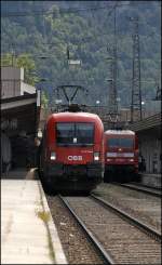 1116 134 steht mit dem OEC 669  Astronomie-Jahr 2009 , Bregenz - Graz Hbf, neben der 101 096 im Bahnhof Kufstein auf die Weiterfahrt. (02.08.2009)