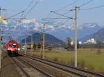 1116 104-9 mit EC bei Langkampfen mit dem Festung Kufstein im Hintergrund.23.03.2010