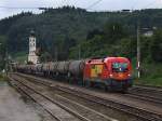 Die 1116 065 am 13.08.2010 mit einem Getreidezug bei der Durchfahrt in Wernstein. 