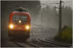 Bei strmendem Regen fhrt 1116 275  Max  mit dem Gterzug 55054 von Villach nach Wien Zvbf.