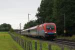 Rail Cargo Hungria 1116 013-2 mit einem EuroCity in Grokarolinfeld am 13.08.2011