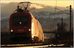 Kurz vor Sonnenuntergang, fhrt 1116 028 mir IC 632  easybank  durch das Murtal. St Lorenzen 25.2.2012